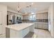 Modern kitchen features stainless steel appliances, a large island, and decorative backsplash at 8031 Tank Loop St, Las Vegas, NV 89166