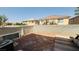 View of the backyard featuring a large dirt area and patio area for outdoor seating at 836 Sheerwater Ave, Henderson, NV 89052
