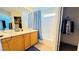 Bathroom with a double sink vanity, shower over tub and a closet at 836 Sheerwater Ave, Henderson, NV 89052