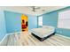 Bright bedroom with ensuite bath features wood floors and a ceiling fan at 836 Sheerwater Ave, Henderson, NV 89052