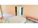 Small bedroom with bench, closet, wood floors, and soft natural light at 836 Sheerwater Ave, Henderson, NV 89052