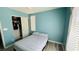 Bedroom with queen bed and built in closet with a window at 836 Sheerwater Ave, Henderson, NV 89052
