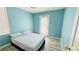 Bedroom with queen bed and door to the backyard at 836 Sheerwater Ave, Henderson, NV 89052