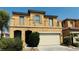 Two-story home featuring a tile roof, balcony, and two-car garage at 836 Sheerwater Ave, Henderson, NV 89052