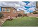 Well-maintained backyard with artificial grass and a privacy wall, ideal for a low-maintenance lifestyle at 92 Tesla Ridge Way, Las Vegas, NV 89183