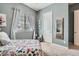 Light and airy bedroom with a colorful butterfly comforter and decor, perfect for a  at 92 Tesla Ridge Way, Las Vegas, NV 89183