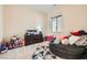 A bedroom with neutral walls offers a window, overhead lighting, and ample space for storage at 92 Tesla Ridge Way, Las Vegas, NV 89183