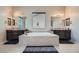 A spacious main bathroom features dual vanities, a soaking tub, and updated fixtures at 92 Tesla Ridge Way, Las Vegas, NV 89183