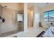 A renovated shower features updated tile and hardware at 92 Tesla Ridge Way, Las Vegas, NV 89183