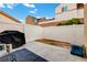 Private backyard enclosed by white fencing, offering a secure and spacious outdoor area at 9292 Vervain Ct, Las Vegas, NV 89149