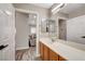 Bathroom features a single sink vanity and doorway leading to the living room at 9292 Vervain Ct, Las Vegas, NV 89149