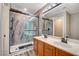 Stylish bathroom features a glass shower and double sink vanity for efficient morning routines at 9292 Vervain Ct, Las Vegas, NV 89149