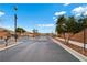 Gated community entrance with trees and landscaping at 9292 Vervain Ct, Las Vegas, NV 89149