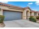 Charming single-story home with a two-car garage, landscaped front yard, and a neutral color palette at 9292 Vervain Ct, Las Vegas, NV 89149