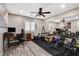 Home gym with wood flooring and equipped with workout equipment, ceiling fan, and full mirror at 9292 Vervain Ct, Las Vegas, NV 89149