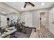 Home gym features workout equipment, wood flooring, and mirrors on the walls at 9292 Vervain Ct, Las Vegas, NV 89149