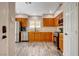 Well-equipped kitchen featuring wooden cabinets, stainless steel appliances, and neutral countertops at 9292 Vervain Ct, Las Vegas, NV 89149