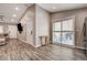 An open-concept living room with lots of natural light and wood-look flooring at 9292 Vervain Ct, Las Vegas, NV 89149