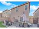 Home's backyard featuring patio furniture and lush artificial turf for relaxation and entertainment at 958 Harbor Ave, Henderson, NV 89002
