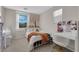 Charming bedroom with light walls and a white vanity with gold accents at 958 Harbor Ave, Henderson, NV 89002