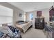 Neutral bedroom featuring a single bed and wall decor, with a dark dresser at 958 Harbor Ave, Henderson, NV 89002