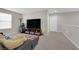 Comfortable bonus room features cozy seating and a large television screen at 958 Harbor Ave, Henderson, NV 89002