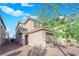 Attractive two-story home featuring an attached two car garage and desert landscaping at 958 Harbor Ave, Henderson, NV 89002