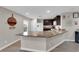 Bright kitchen with granite countertops, stainless steel sink, and dark cabinetry at 958 Harbor Ave, Henderson, NV 89002