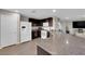 Spacious kitchen with granite counters, stainless appliances, and dark wood cabinets at 958 Harbor Ave, Henderson, NV 89002