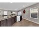 Contemporary kitchen with stainless sink, granite countertops, and modern appliances at 958 Harbor Ave, Henderson, NV 89002