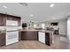 Modern kitchen featuring granite countertops, a breakfast bar, and stainless steel appliances at 958 Harbor Ave, Henderson, NV 89002
