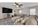 Comfortable living room with hardwood floors, a sectional sofa and a flat-screen TV at 958 Harbor Ave, Henderson, NV 89002
