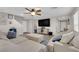 Spacious living room offers a large sectional sofa, hardwood floors and a ceiling fan at 958 Harbor Ave, Henderson, NV 89002