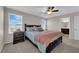 This spacious main bedroom has carpet flooring and a view into the bathroom at 958 Harbor Ave, Henderson, NV 89002