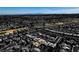 Gorgeous aerial view of property nestled in lush, green golf course community with mountains visible in the distance at 9816 Gerald Ct, Las Vegas, NV 89134