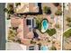 Aerial view of a house with a pool, putting green, covered patio, and well-maintained landscaping at 9816 Gerald Ct, Las Vegas, NV 89134