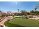 Backyard features a pool, desert landscaping, and turf at 9816 Gerald Ct, Las Vegas, NV 89134