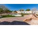 Backyard featuring turf, a pool, and desert landscaping at 9816 Gerald Ct, Las Vegas, NV 89134