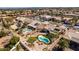 A backyard oasis featuring a pool, lush landscaping, and a covered patio, perfect for relaxation and entertainment at 9816 Gerald Ct, Las Vegas, NV 89134