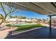 Inviting backyard with a pool, covered patio, and ample space for entertaining guests at 9816 Gerald Ct, Las Vegas, NV 89134