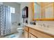Well-lit bathroom with a combination shower and tub and plenty of vanity space at 9816 Gerald Ct, Las Vegas, NV 89134