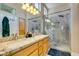 Bathroom featuring a walk-in shower, granite counter tops, and dual sinks at 9816 Gerald Ct, Las Vegas, NV 89134