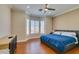 Spacious bedroom with a large bay window, ceiling fan, and walk in closet at 9816 Gerald Ct, Las Vegas, NV 89134