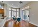 Sunlit dining area with a stylish table and sliding glass door leading to the backyard at 9816 Gerald Ct, Las Vegas, NV 89134