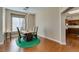 Bright dining room with hardwood floors, a live-edge table, and modern lighting at 9816 Gerald Ct, Las Vegas, NV 89134