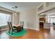 Bright dining room with hardwood floors, modern lighting, and seamless access to the kitchen at 9816 Gerald Ct, Las Vegas, NV 89134