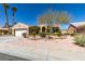 Inviting single-story home with a manicured front yard, desert landscaping, and an attached two-car garage at 9816 Gerald Ct, Las Vegas, NV 89134