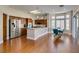 Open concept kitchen and breakfast nook with hardwood floors and stainless steel appliances at 9816 Gerald Ct, Las Vegas, NV 89134