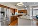 Bright kitchen with granite countertops, stainless steel appliances, and pendant lighting at 9816 Gerald Ct, Las Vegas, NV 89134