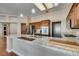 Kitchen island with granite countertops, stainless appliances, and wood floors at 9816 Gerald Ct, Las Vegas, NV 89134